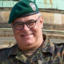 Ein Mann mit Brille und in Uniform. Portraitfoto.